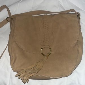 This is a tan hand bag never worn.